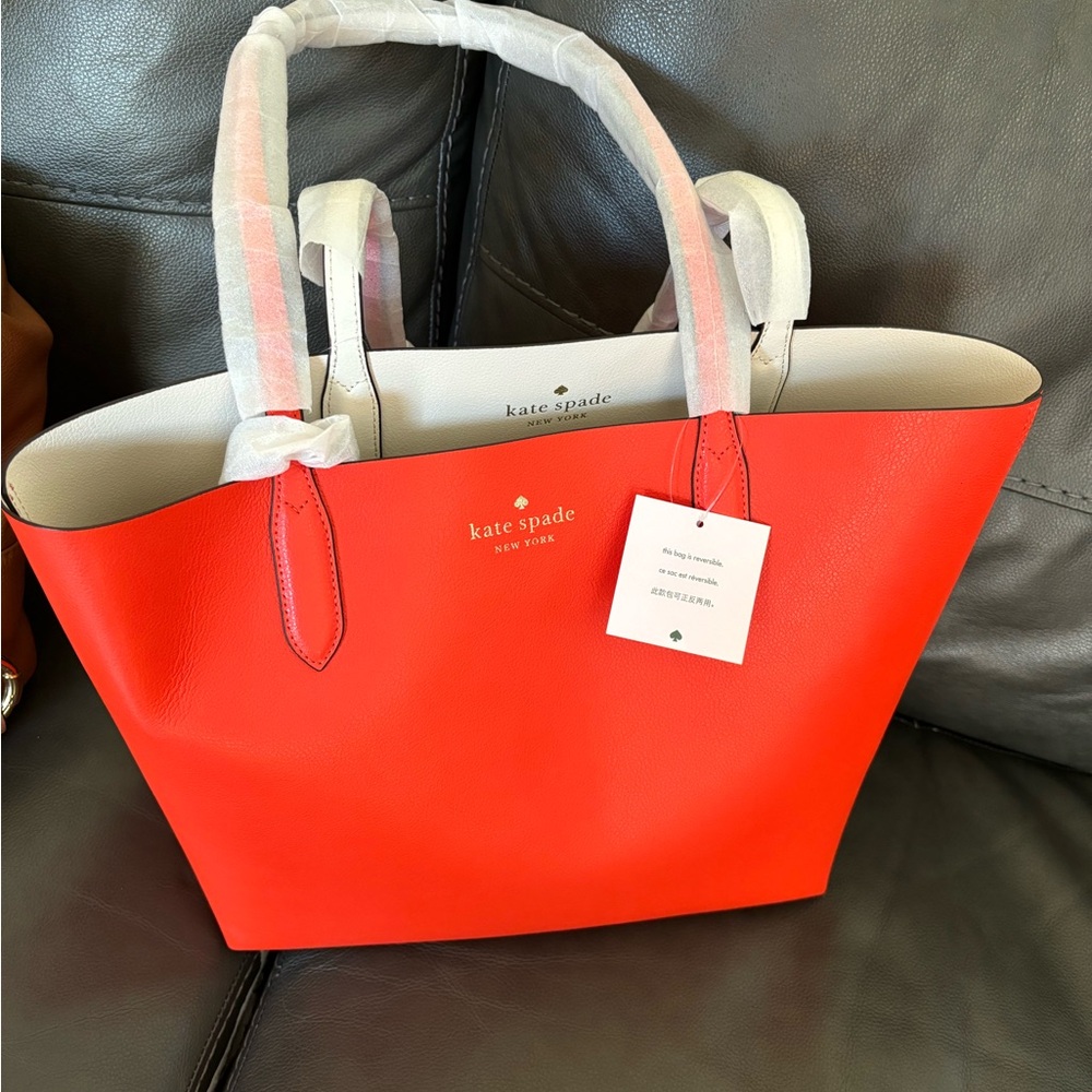 Orange Kate Spade New bag tags still on it